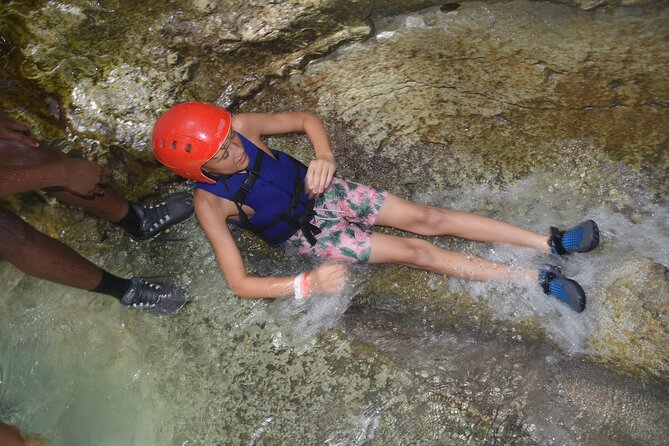 Excursion in Damajagua's 7 Waterfalls With Food Included DR! - Swimming and sliding with a helmet and vest: why the gear matters