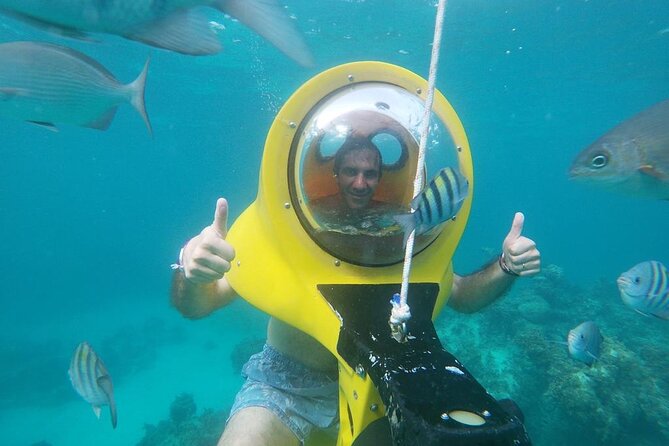 Experience a Submarine Scooter with ScubaDoo Punta Cana - Riding the ScubaDoo scooter at about 3/4 meters, seated and mask-free