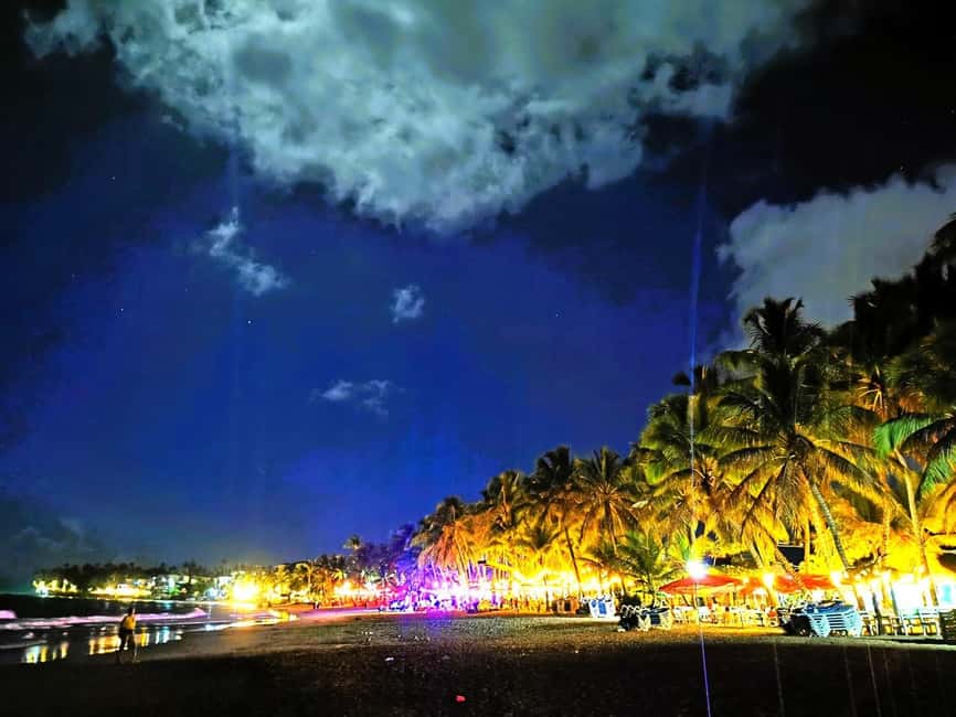 Experience the Nightlife: Puerto Plata + Sosua + Cabarete - Cabarete beach nightlife: palm trees, sand-level venues, and dancing