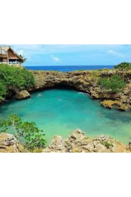 Explore Higüey:Basilica,Market,Museum Cave,River Ride,lunch - Cueva Taina: cave art, cool air, and respectful walking