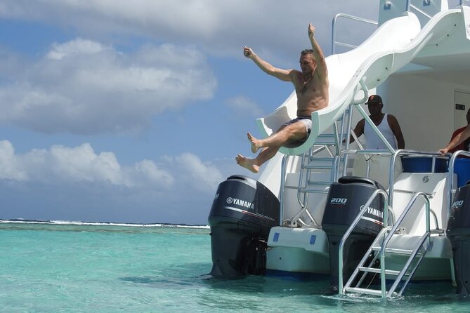 Full-Day Tour Isla Bonita Deluxe - Catamaran time on The Ocean King Deluxe: solarium, slide, and onboard help