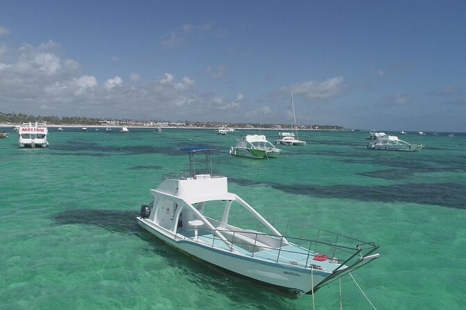 GlassBottom Catamaran with Slide - Glass-bottom windows, snorkeling gear, and the slide stop in warmer water
