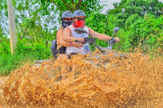 Half-Day Adventure 4x4 ATV, cenote and Macao beach in Punta Cana - Macao Beach Time: Waves, Sand, and Limestone Cliffs