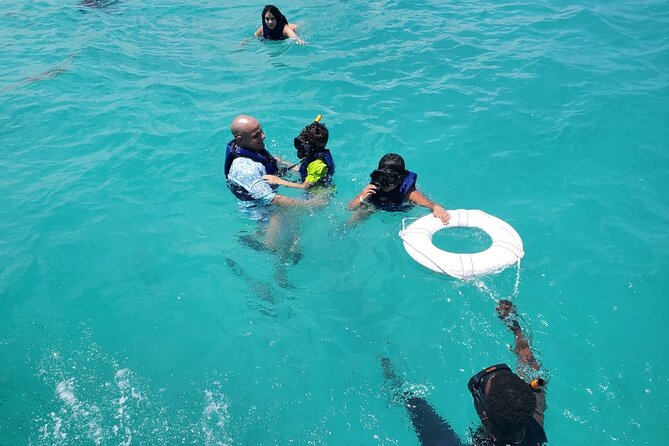 Party Boat and Snorkeling Family-friendly Semi-Private - Food and drinks onboard: fresh burger, tropical fruits, and rum options