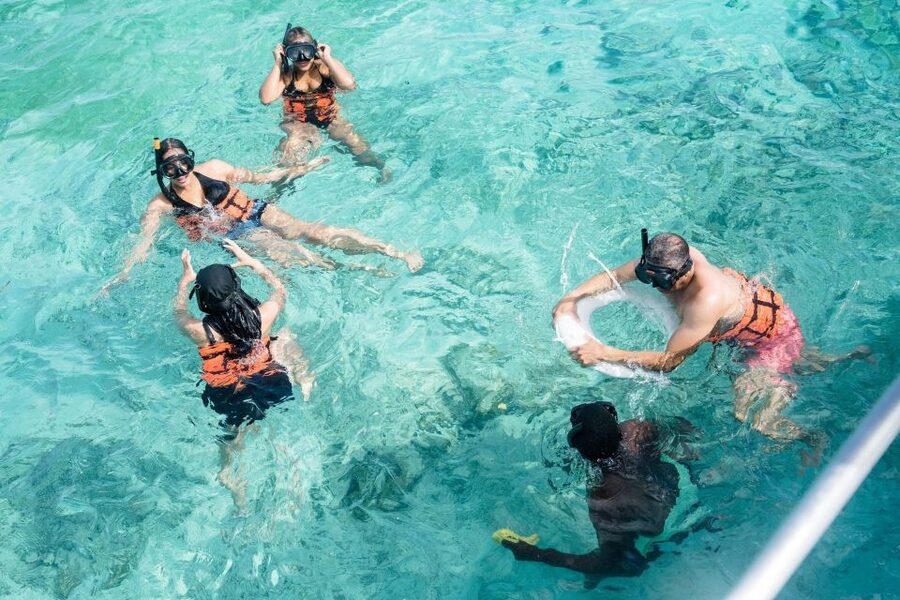 Punta Cana: Catamaran Tour with Reef Snorkeling and Open Bar - Crew energy and names you might hear onboard