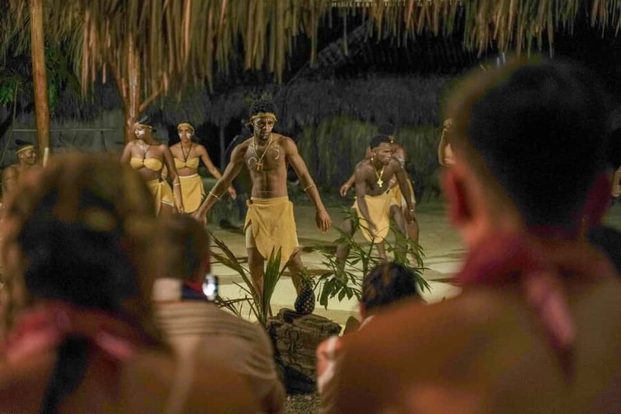 Punta Cana: Sunset Buggy Tour With Cave Swim and Dance Show - Torchlight on the way to the cenote cave pool