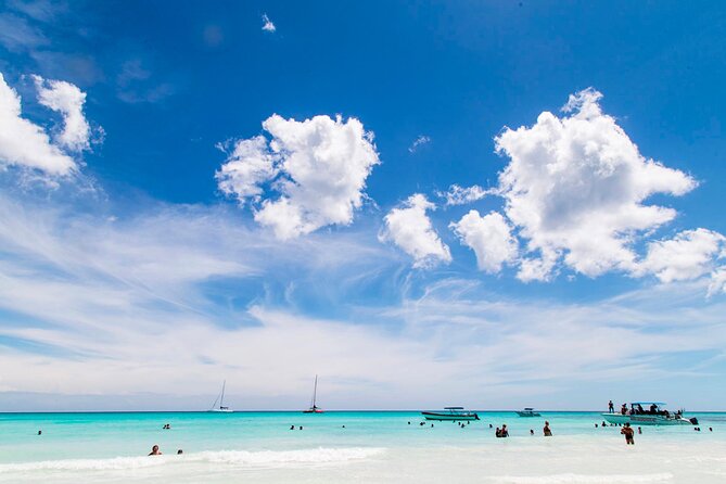 Saona Catamaran Cruise with Lunch and Natural Swimming Pool - Beach time on Saona: beautiful water, but plan for sellers and uneven comfort