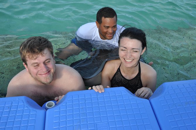 Small Group Snorkeling, Sharks & Stingrays Encounter by boat - Drinks, Music, and the Photo Reality Check