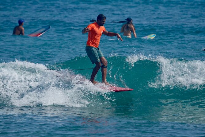 Surfing lesson at beautiful beach Playa Encuentro - Cabarete Surf Company and getting ready on Playa Encuentro